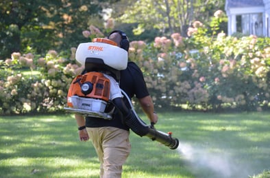 Pure Solutions service technician spraying for ticks.