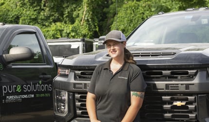 Shannon in front of a Pure Solutions truck 