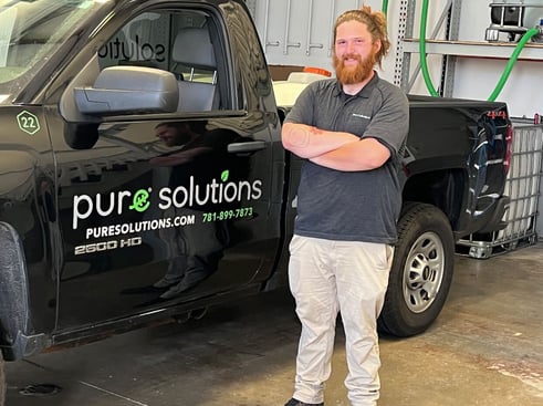 North Shore general manager in front of Pure Solutions truck